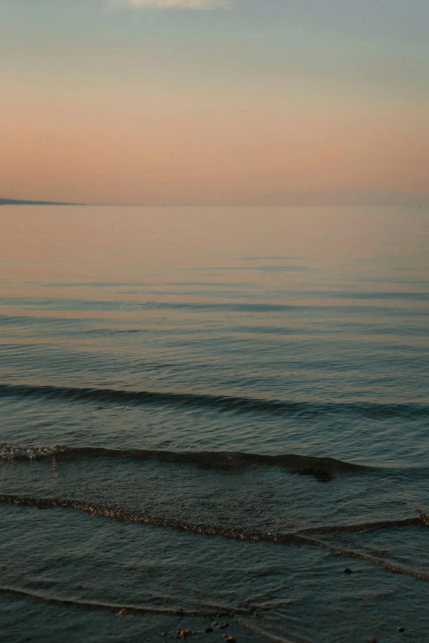 A calm lake reflecting warm golden light